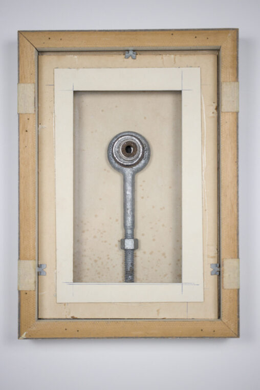 Portrait, assemblage by Laura Kinney with found eye bolt and rusty washers on glass in a reversed wood frame